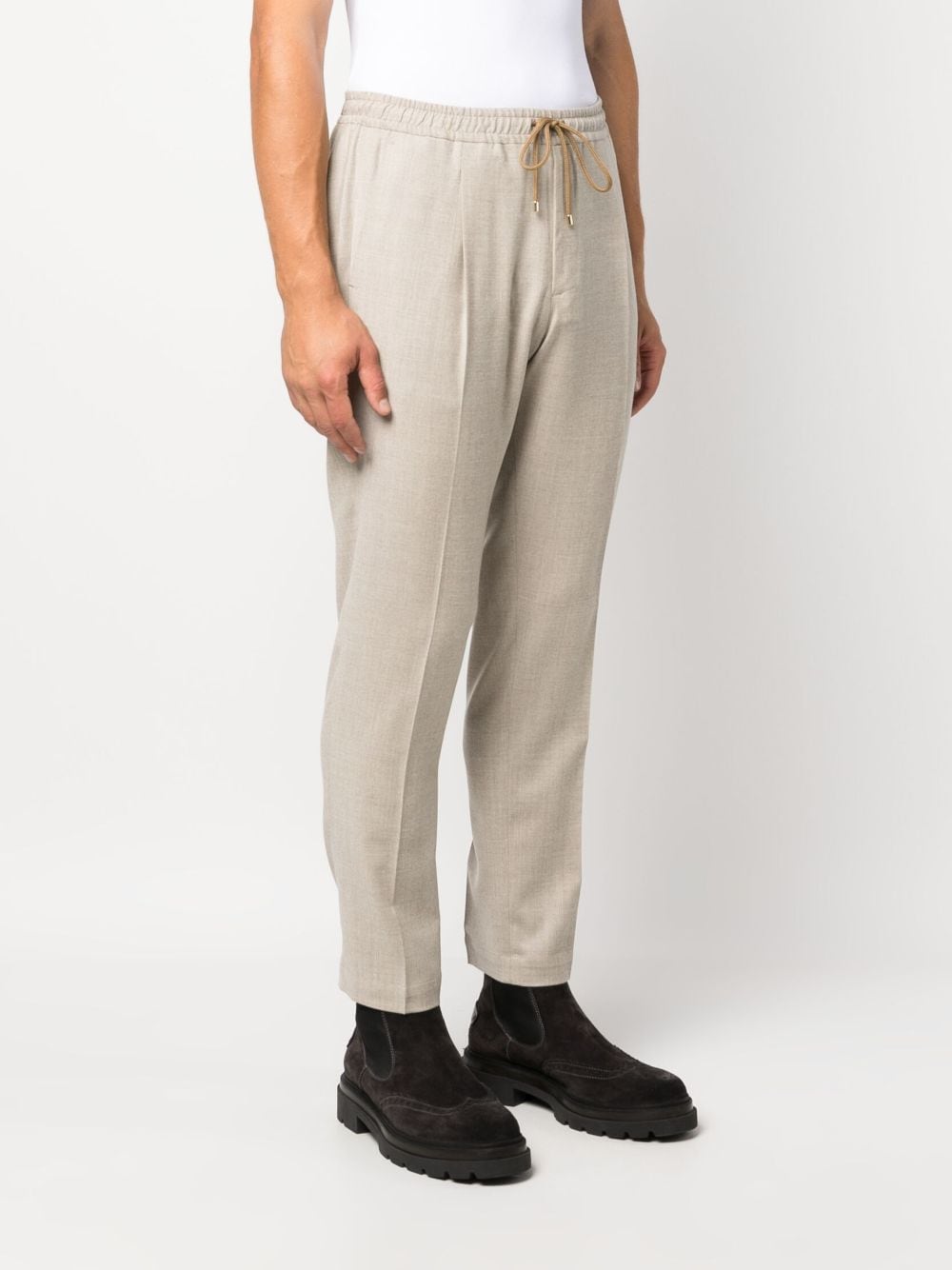 Beige pleated tapered trousers men